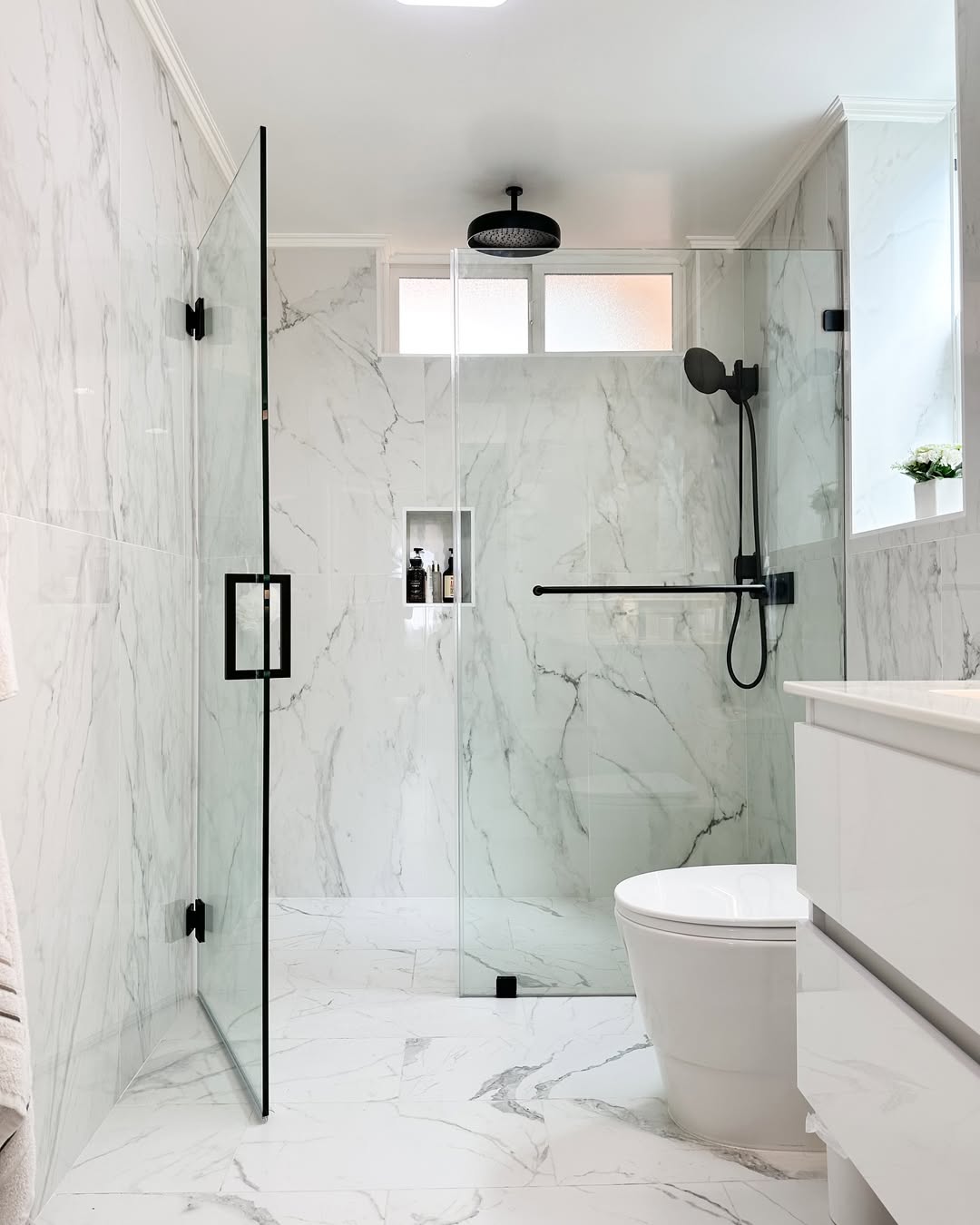 Recessed Shower Niche With Dark Bottles