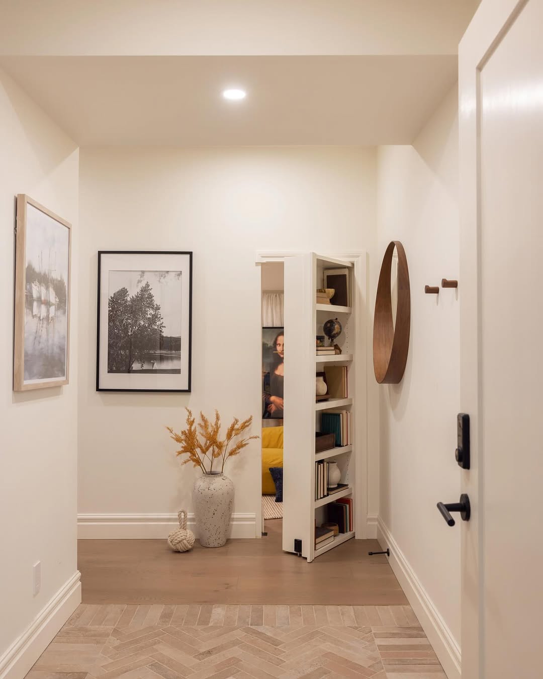 Narrow Bookshelf Door Hides a Cozy Reading Nook