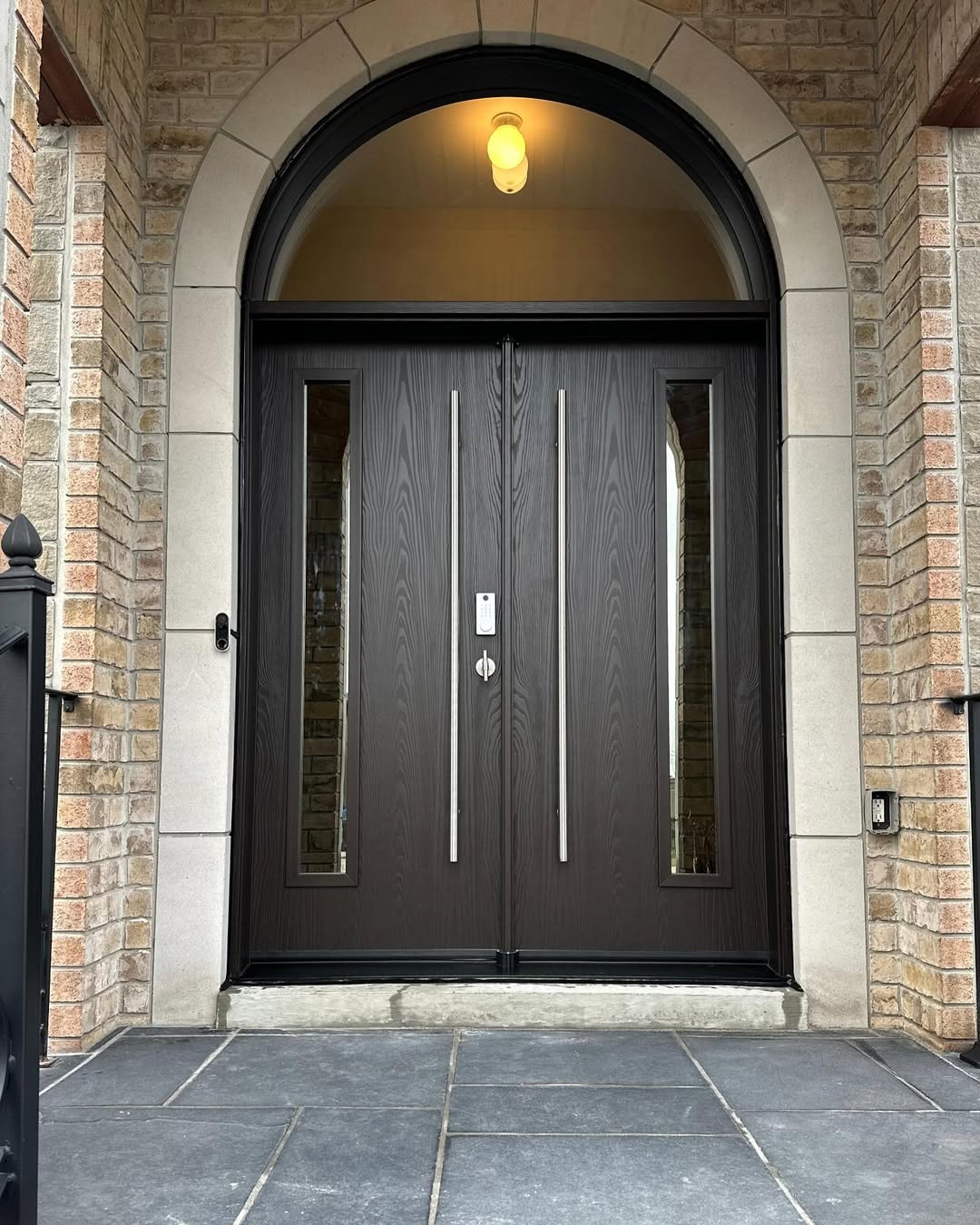 Dark Wood Doors with Tall Vertical Windows