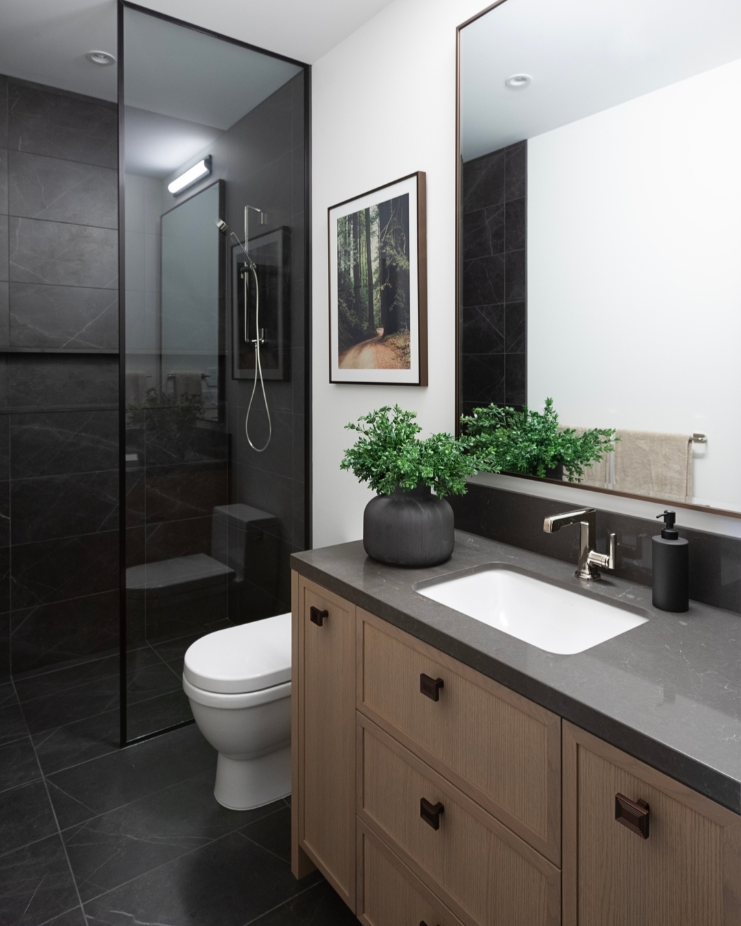 Artwork Adds a Nature Scene to a Dark Bathroom
