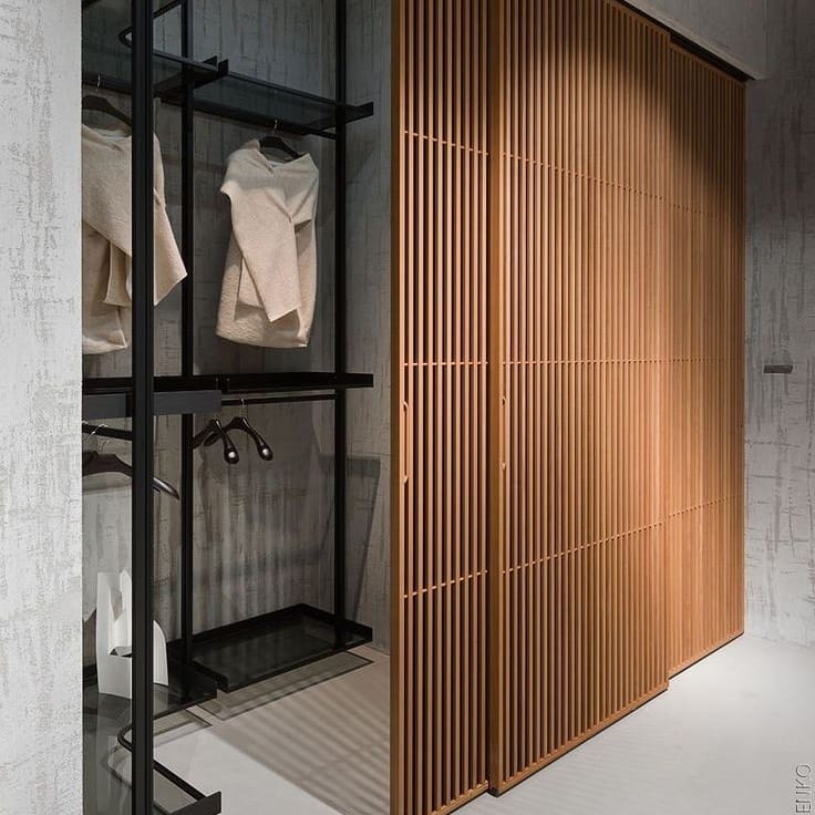 Slatted Wood Panels Slide to Conceal Storage