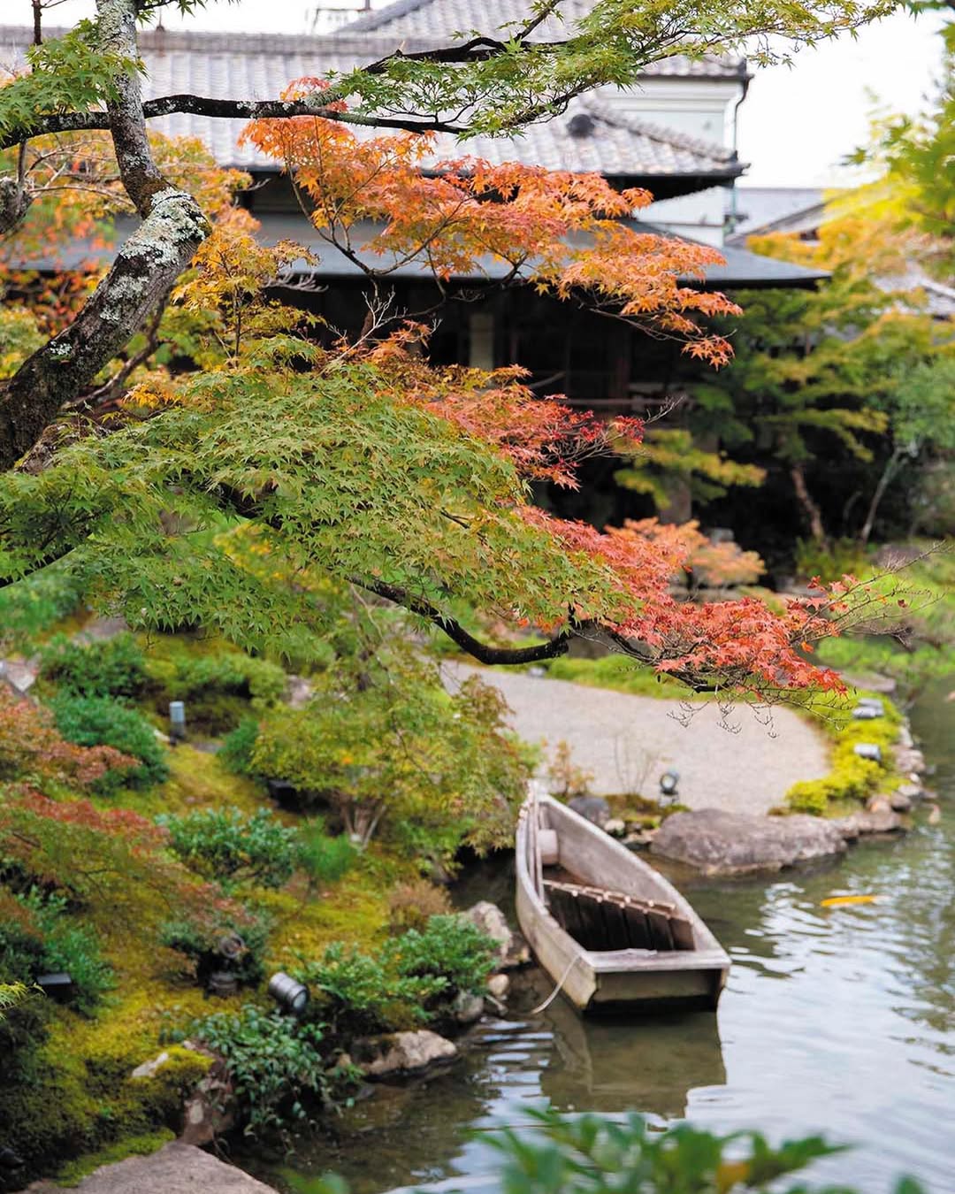Wooden Boat Adds a Rustic Accent to Water Gardens