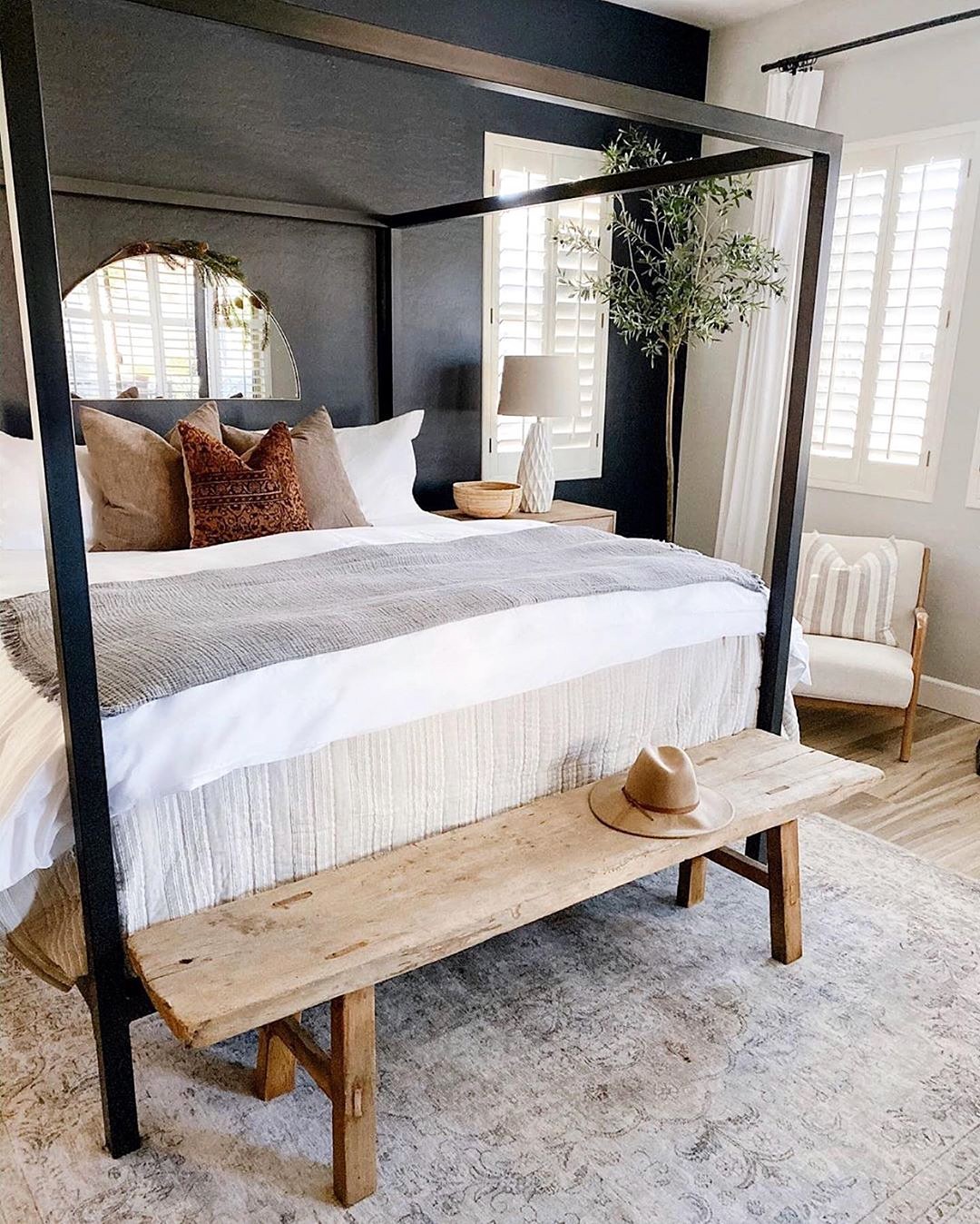 Layered Bedside Seating with a Rustic Bench