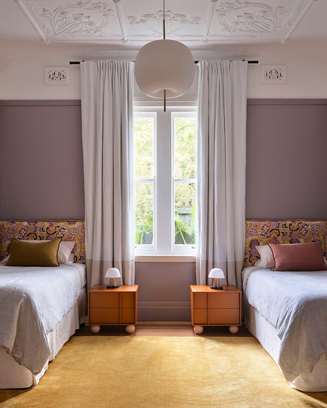 Orange Nightstands Add Playful Color Between Beds