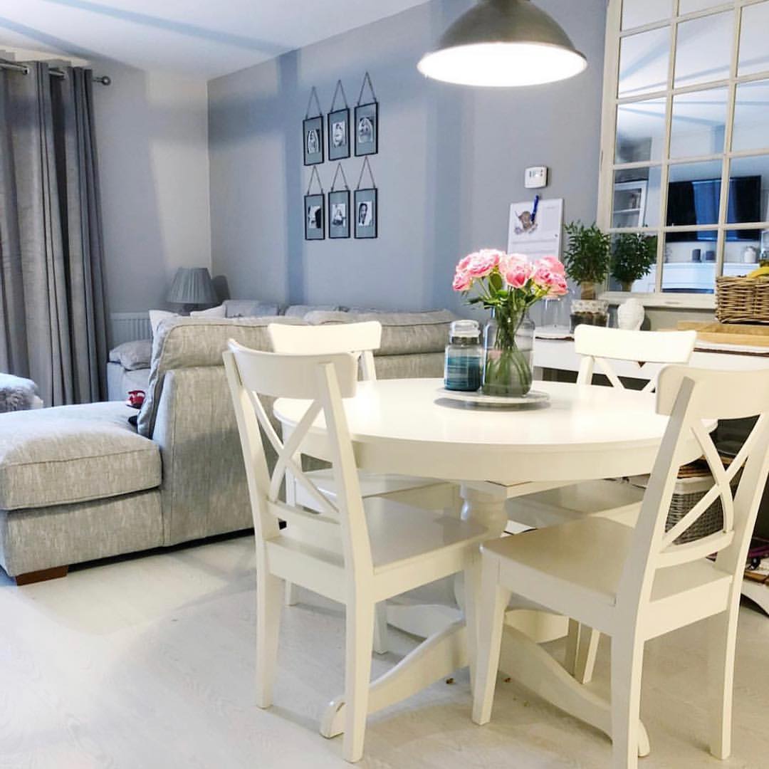 White X-Back Chairs Define a Bright Dining Space