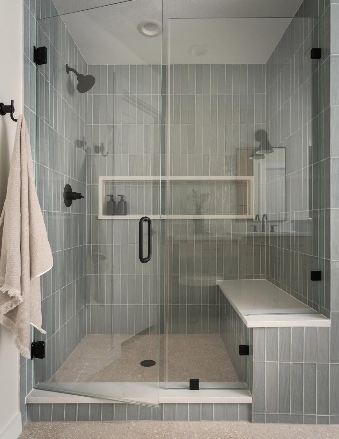 Built-In Shower Bench With a Marble-Look Surface