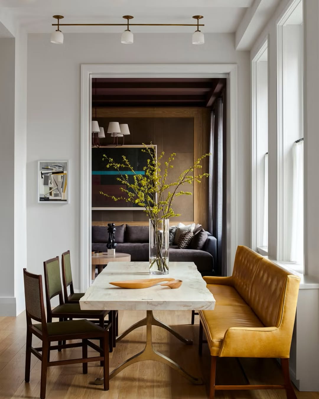Marble-Top Table Anchored by a Sculptural Metal Base