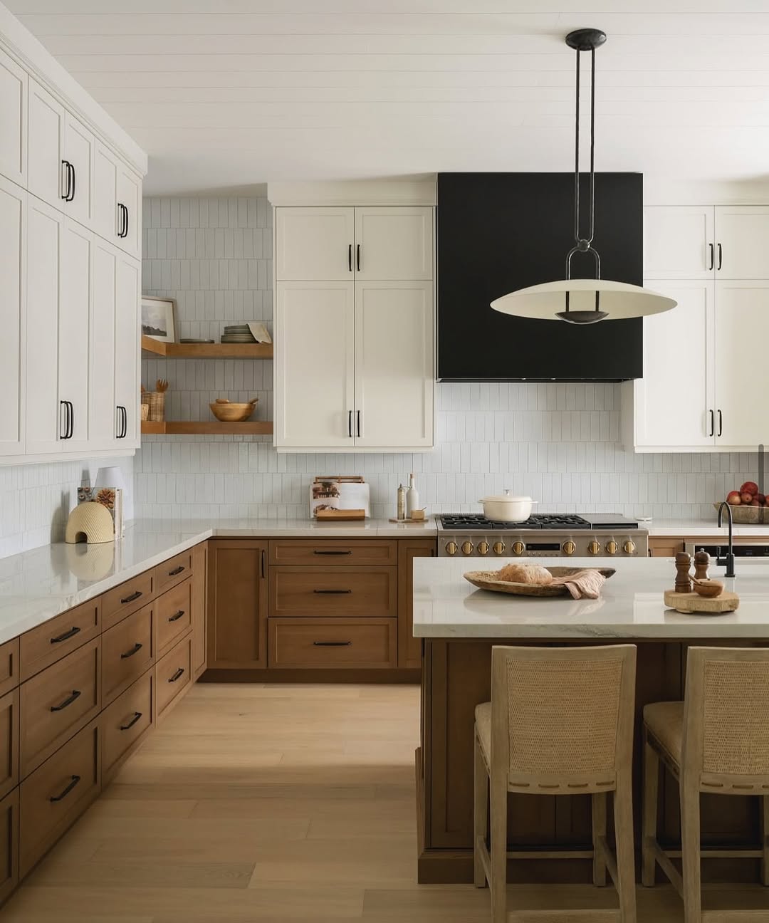 Two-Tone Cabinetry Creates Visual Depth and Warmth