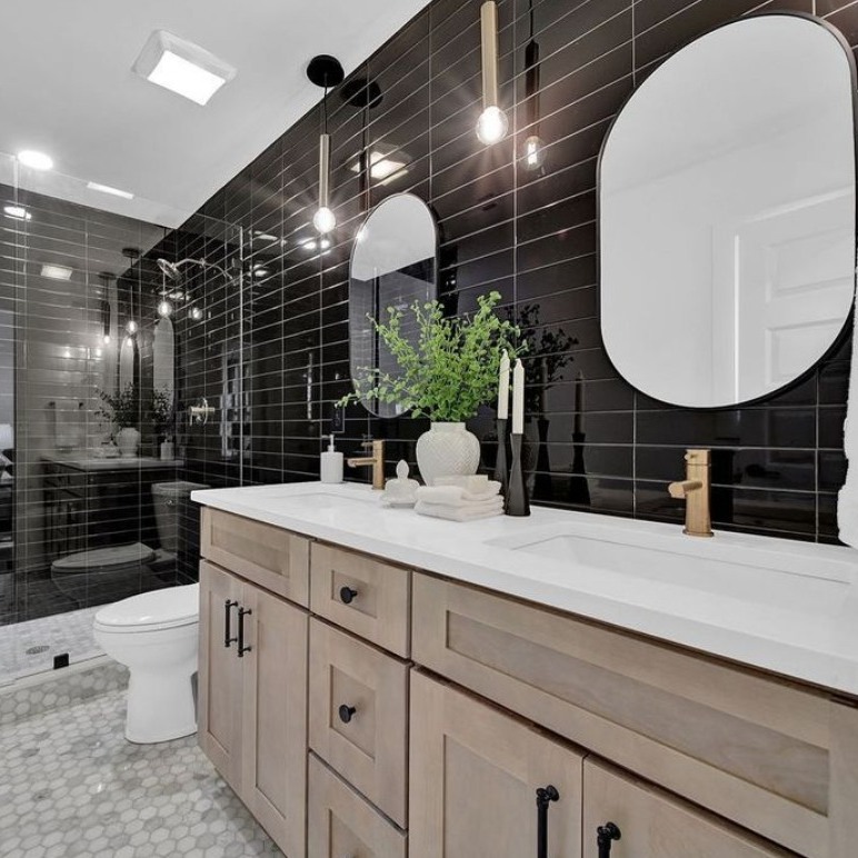 Asymmetrical Oval Mirrors Balance a Double Vanity