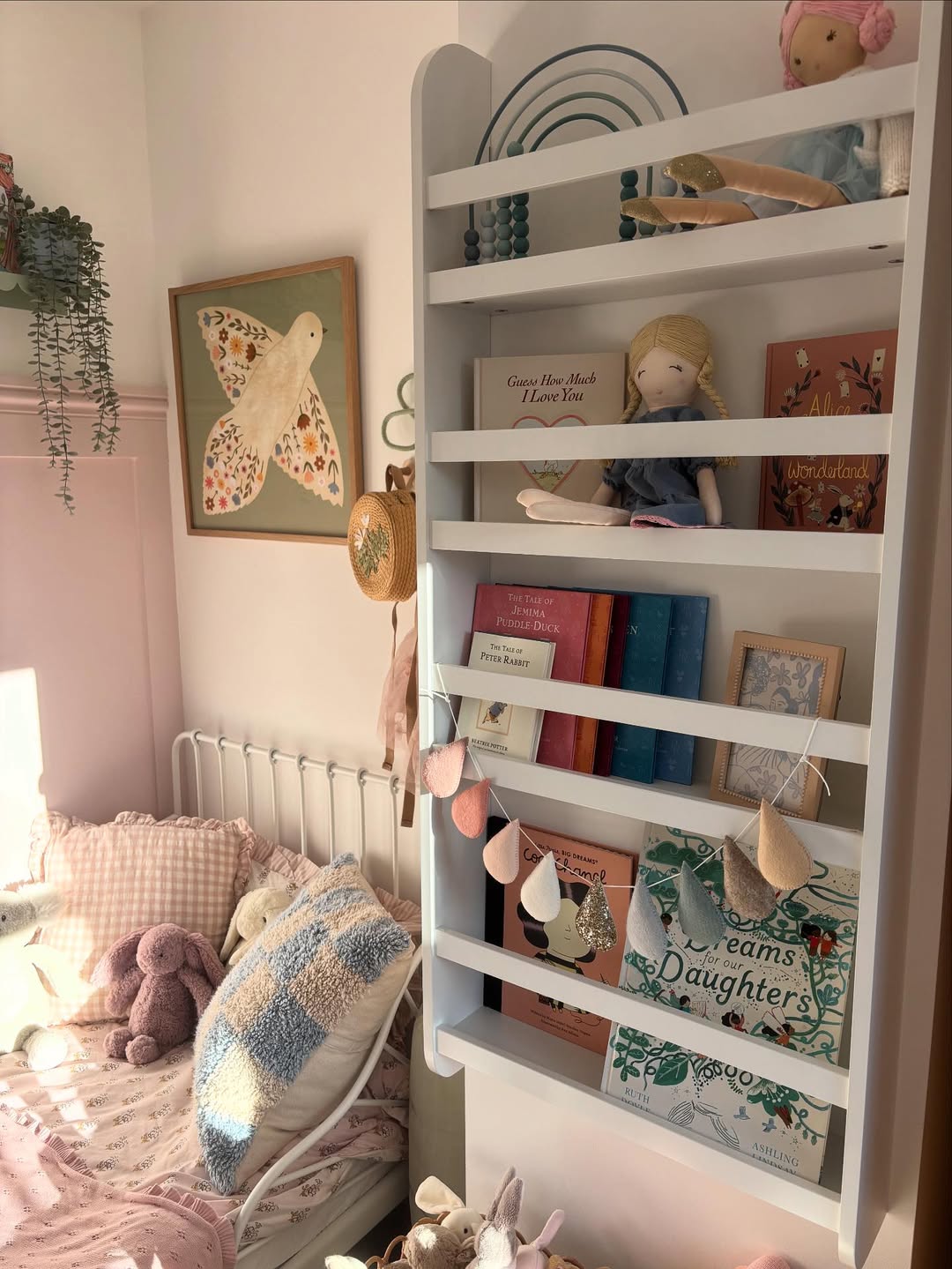 White Tiered Shelving Displays Books and Toys