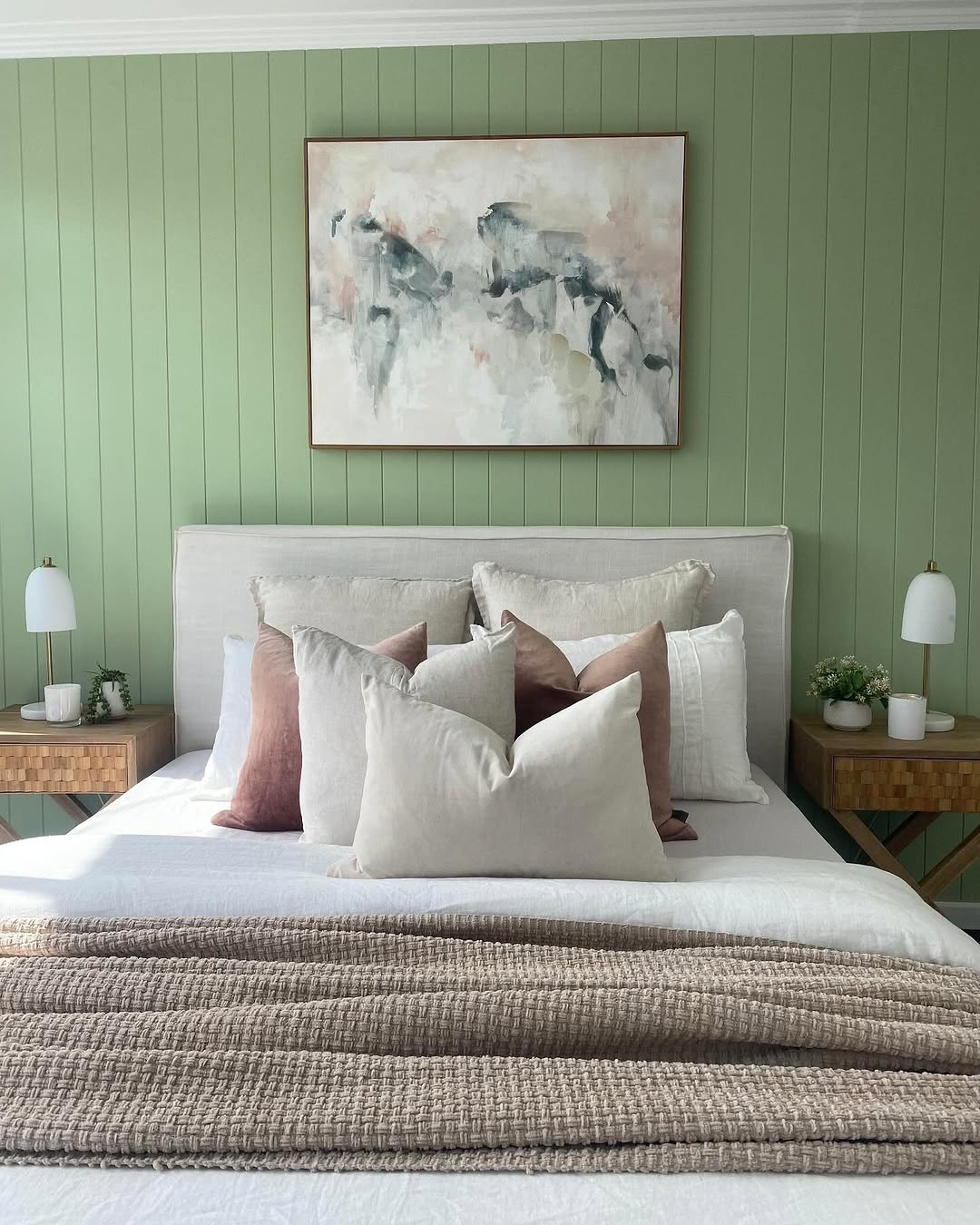 Textured Wooden Nightstands with Minimalist Lamps and Greenery