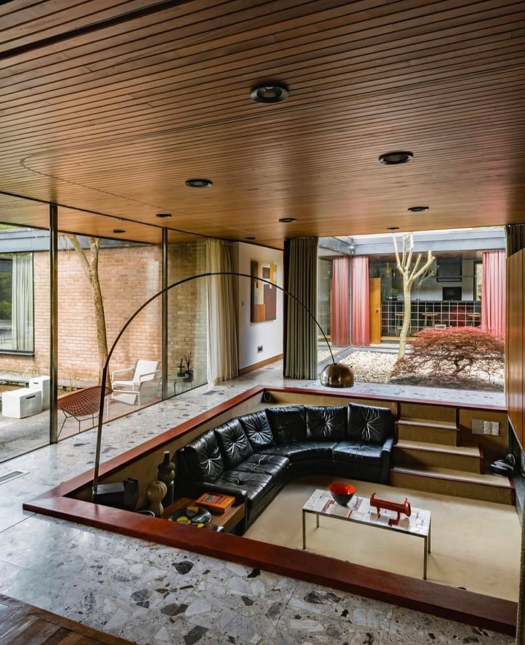 Sunken Den with Built-In Seating Creates a Cozy Conversation Pit