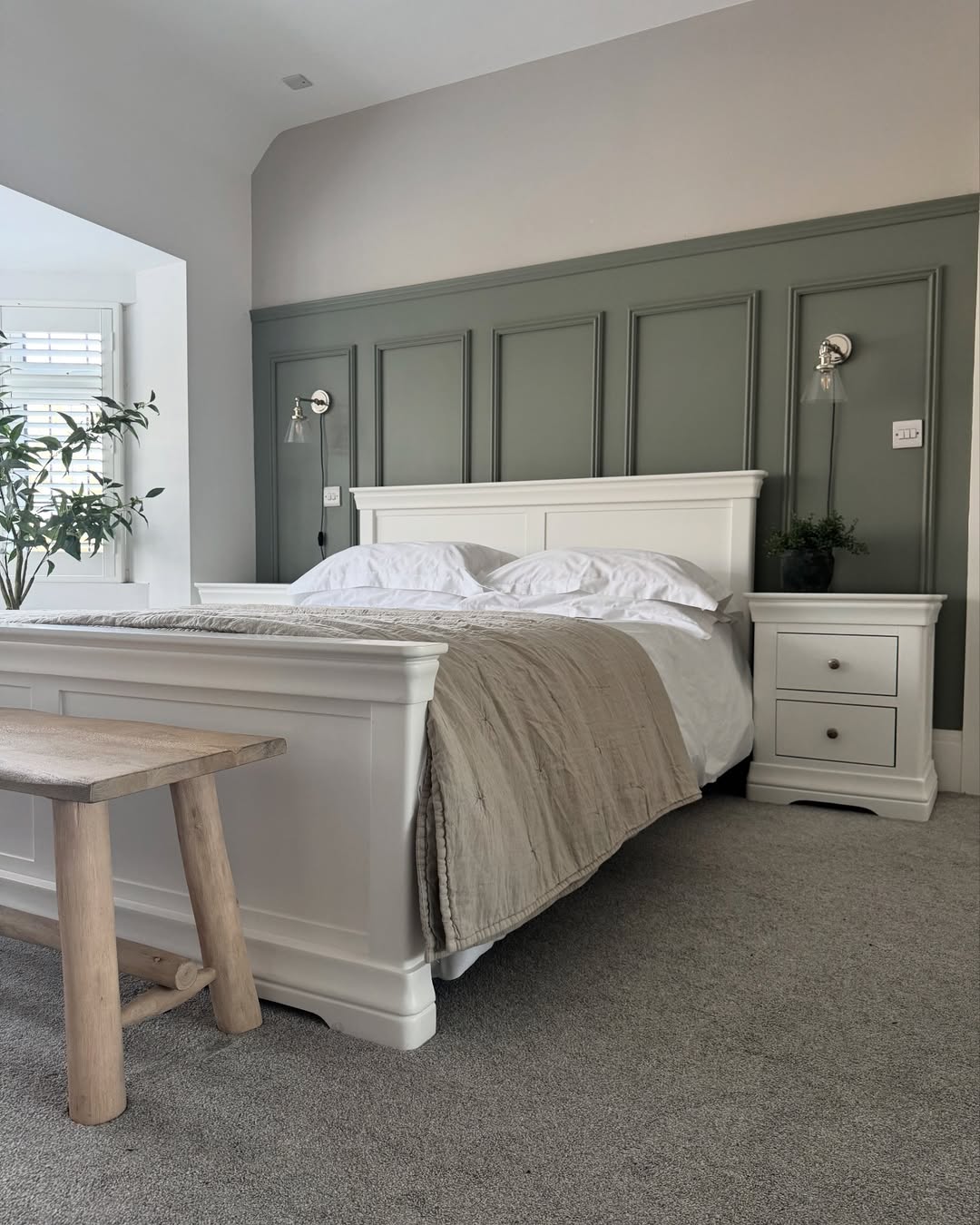 Paneled Walls Add Architectural Interest Above the Bed