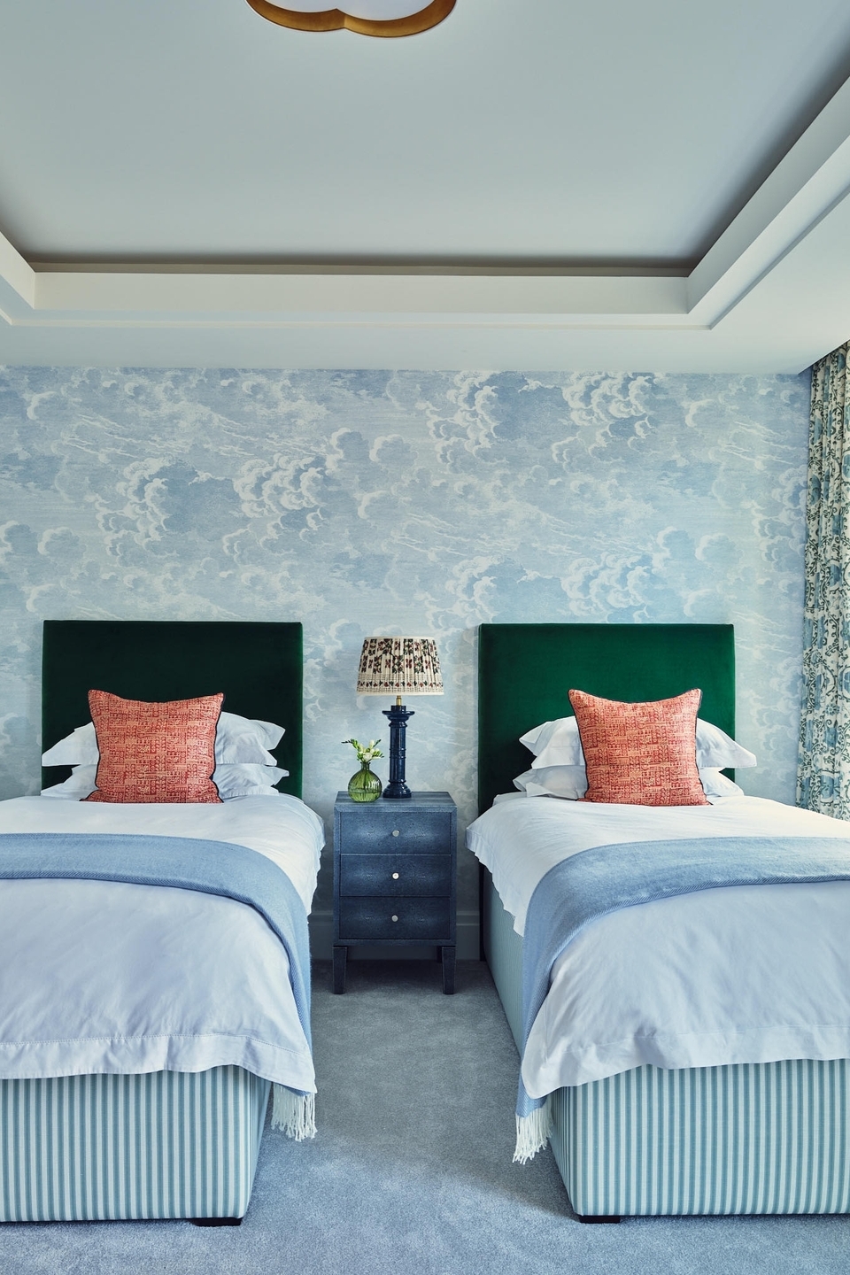 Cloud Wallpaper Creates a Dreamy Atmosphere Above Twin Beds