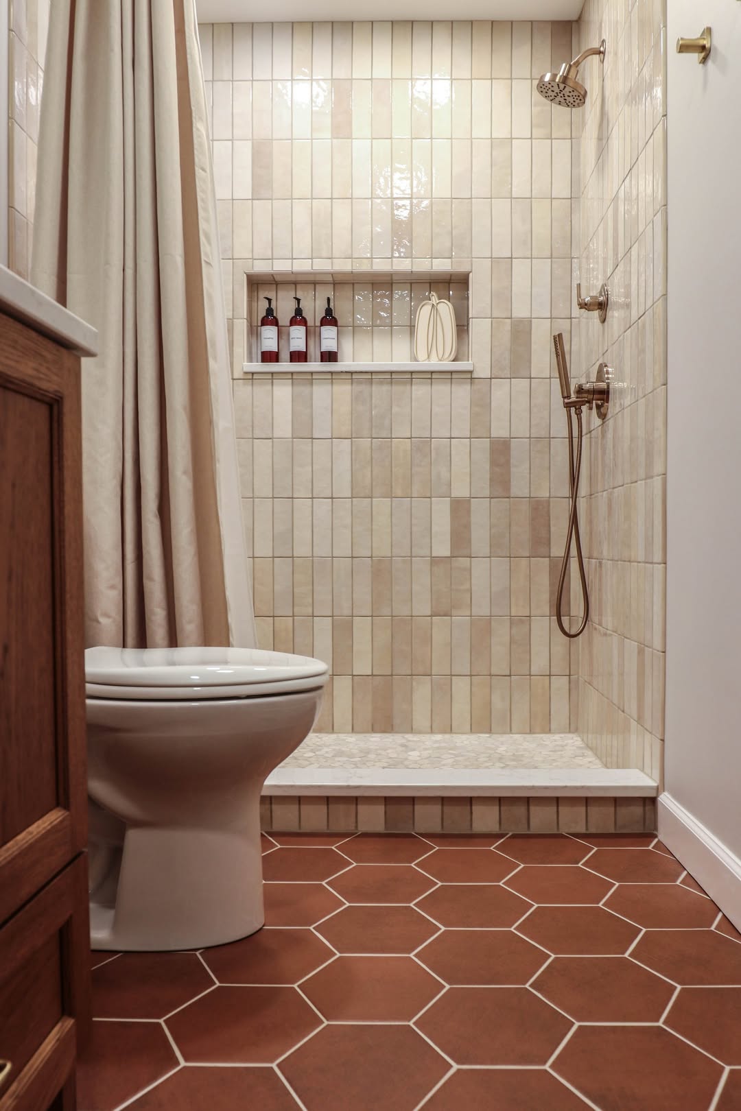 Vertical Stick Tile in Varying Tones Creates a Textured Shower Wall