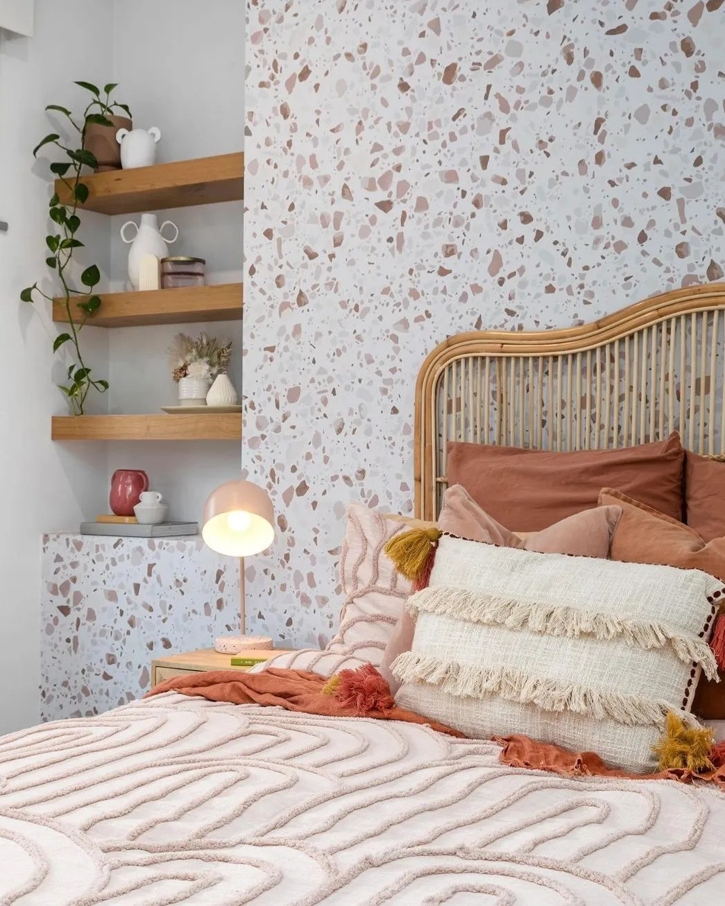 Maximize Vertical Space with Floating Shelves Next to Terrazzo Wall