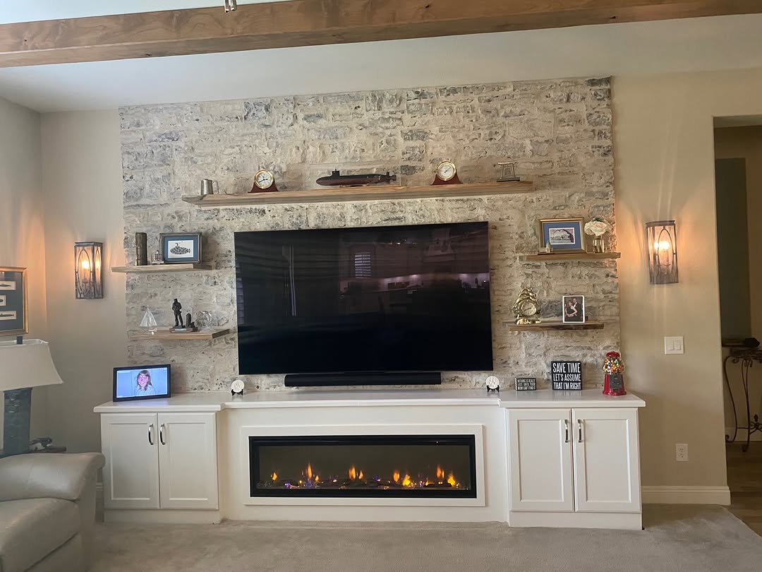 Floating Wood Shelves Against a Textured Stone Wall