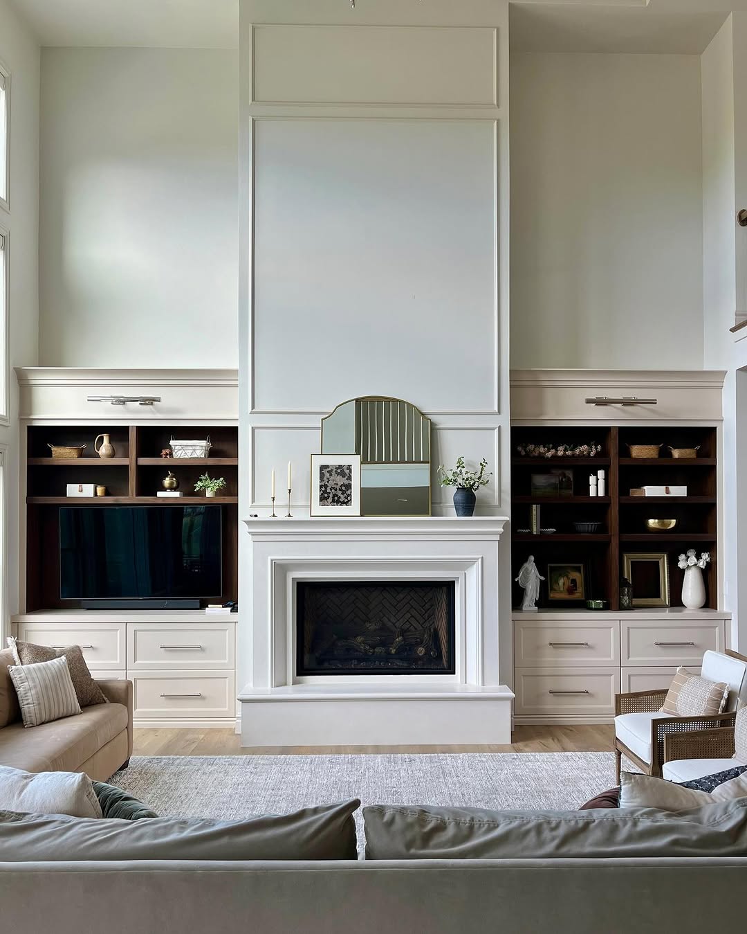 Tall Built-Ins Mix Dark Wood Shelves With Light Drawers