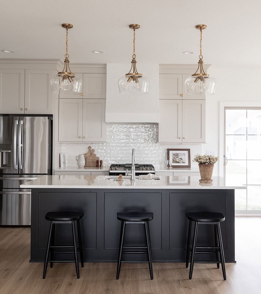 Clear Glass Pendant Lights Add Warmth Over Island