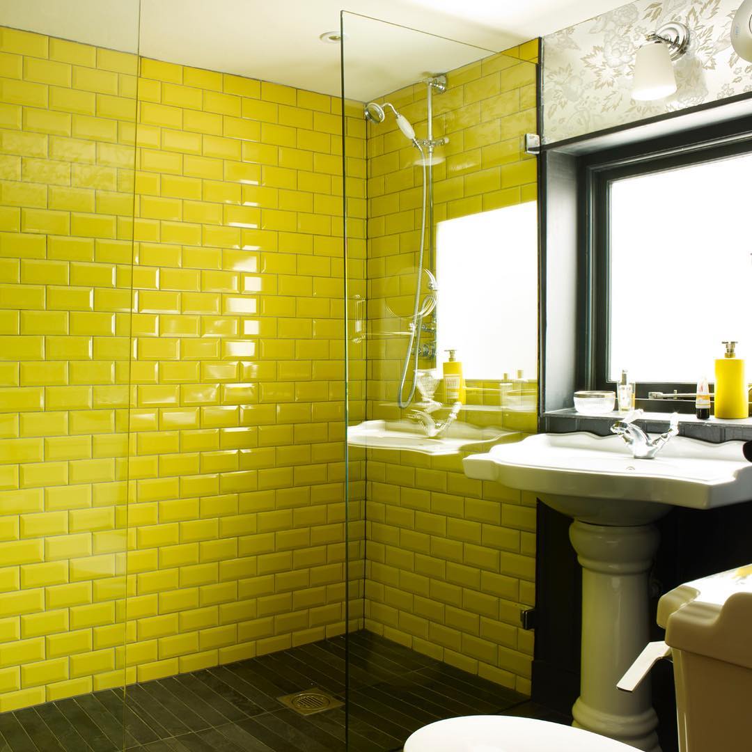 Yellow Subway Tile Shower Enclosure Creates a Bright, Seamless Look