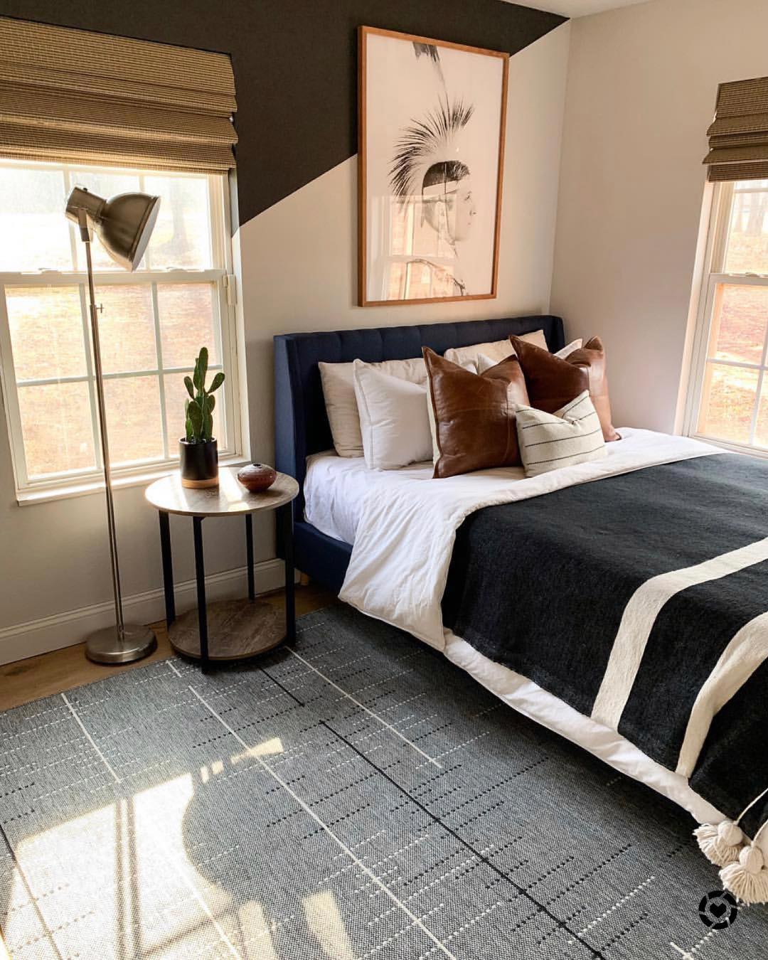 Anchor Your Room with Large Graphic Artwork Above the Bed