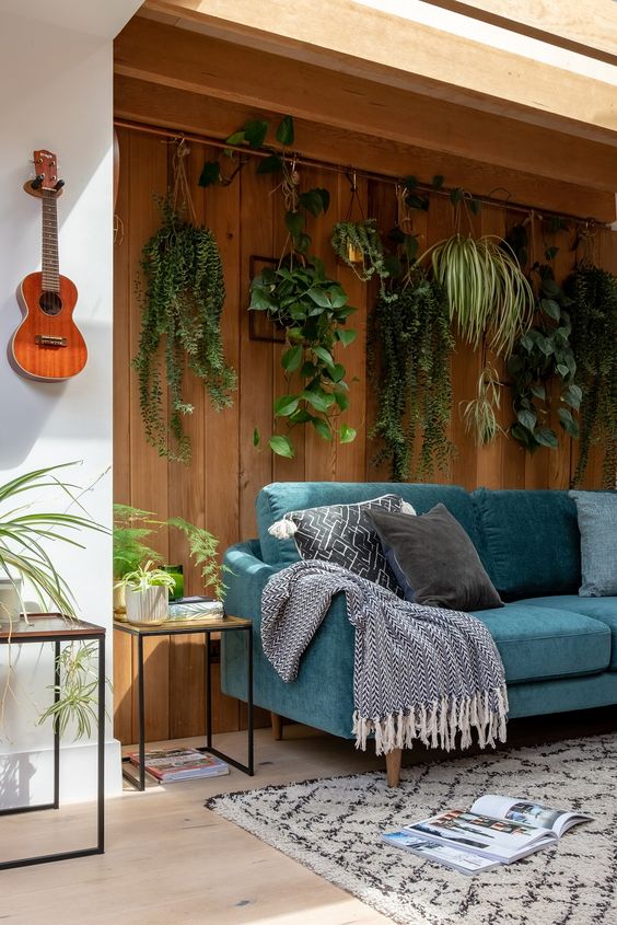 Hanging Plants Create a Living Curtain on Wood Paneling