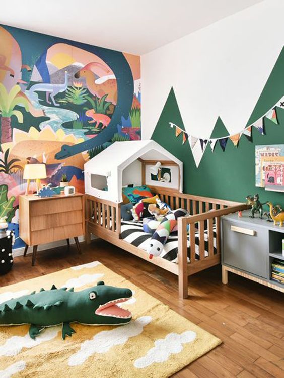 Dinosaur Mural and Mountain Wall Create a Prehistoric Landscape