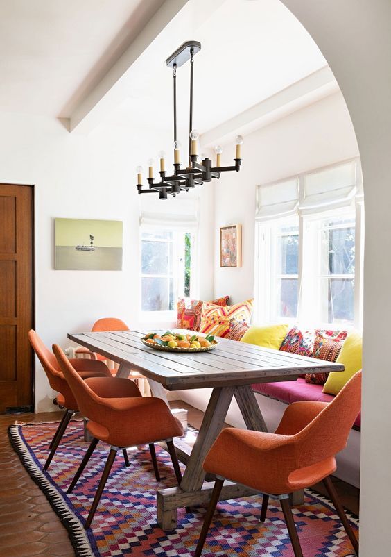 Layer Cushions on a Bench for a Cozy Dining Nook