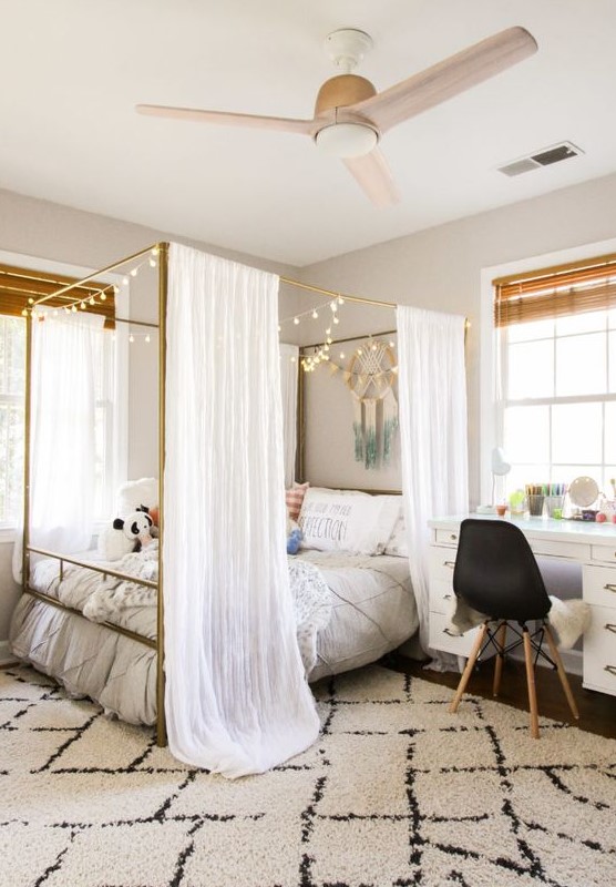 Drape Curtains Around a Gold Canopy Bed for a Dreamy Feel