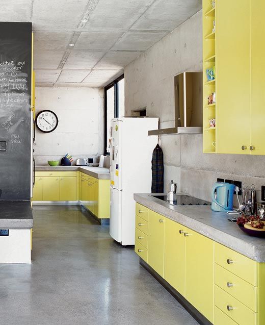 Contrast Yellow Cabinets with Concrete Walls