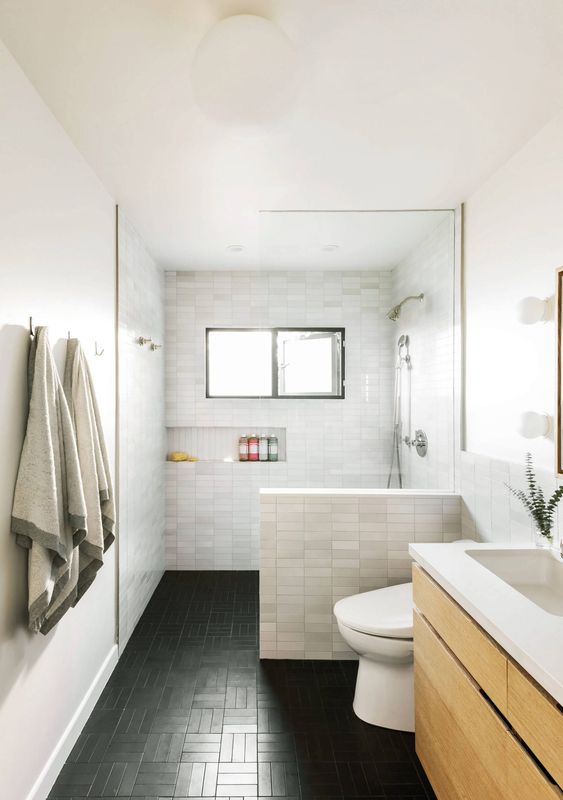 Tiled Half Wall Creates a Built-in Niche for Toiletries