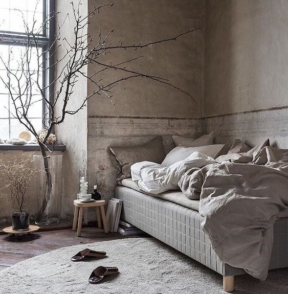 Bare Branches Add Sculptural Interest to a Neutral Bedroom