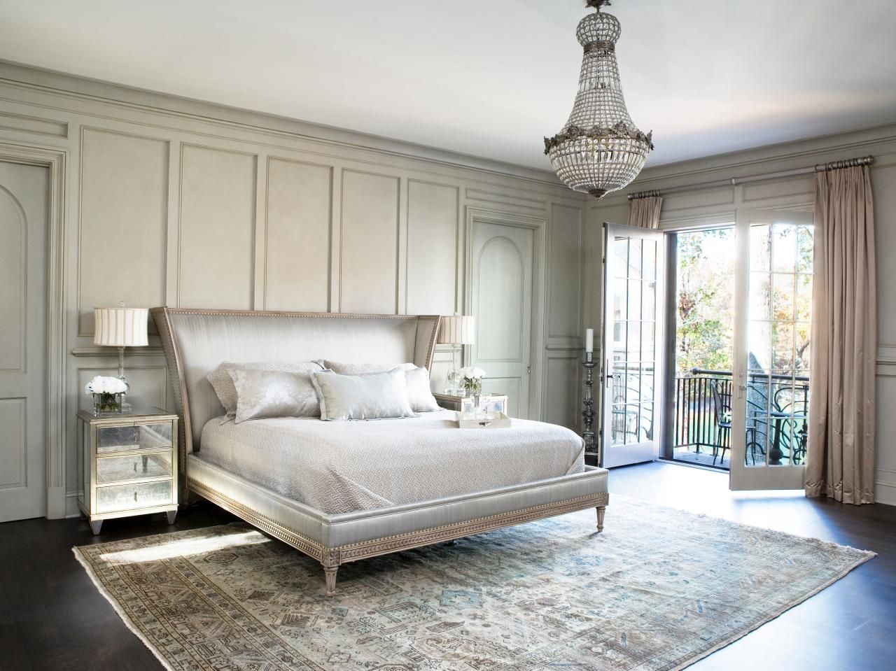Mirrored Nightstands Add Glamour Beside Tall Headboard