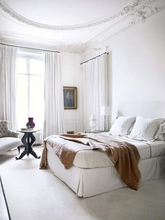 Introduce Warmth with a Textured Throw Blanket on Crisp White Bedding