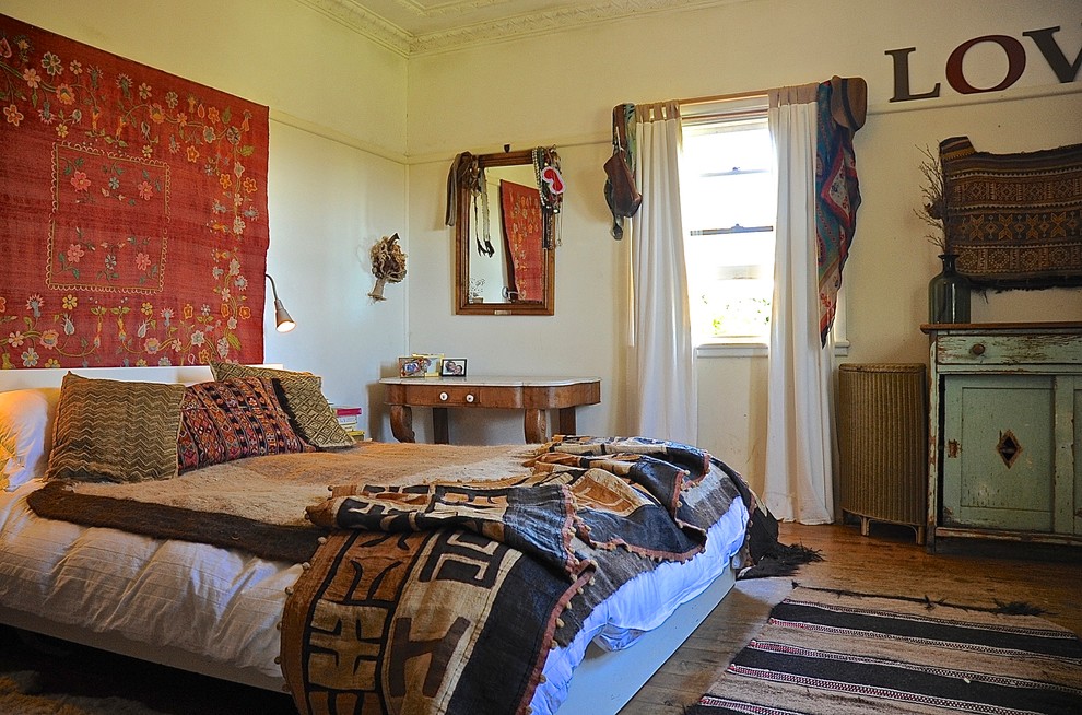 Large Red Textile Art Adds Floral Pattern Above Bed