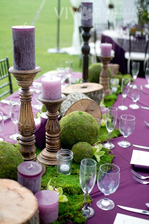 Wooden Candle Holders Ground a Mossy Centerpiece