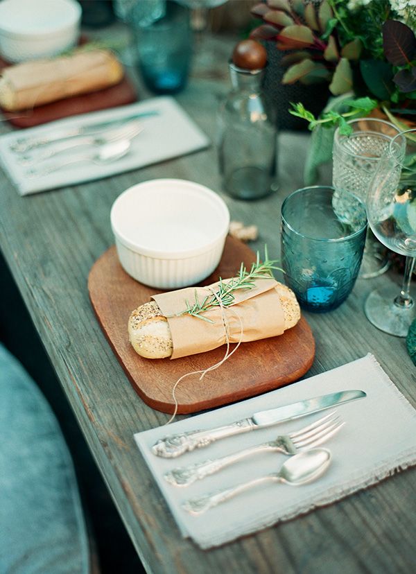 Wooden Board Presents Bread with Rosemary