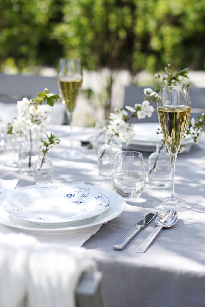Small Glass Vases Hold Delicate Cherry Blossoms