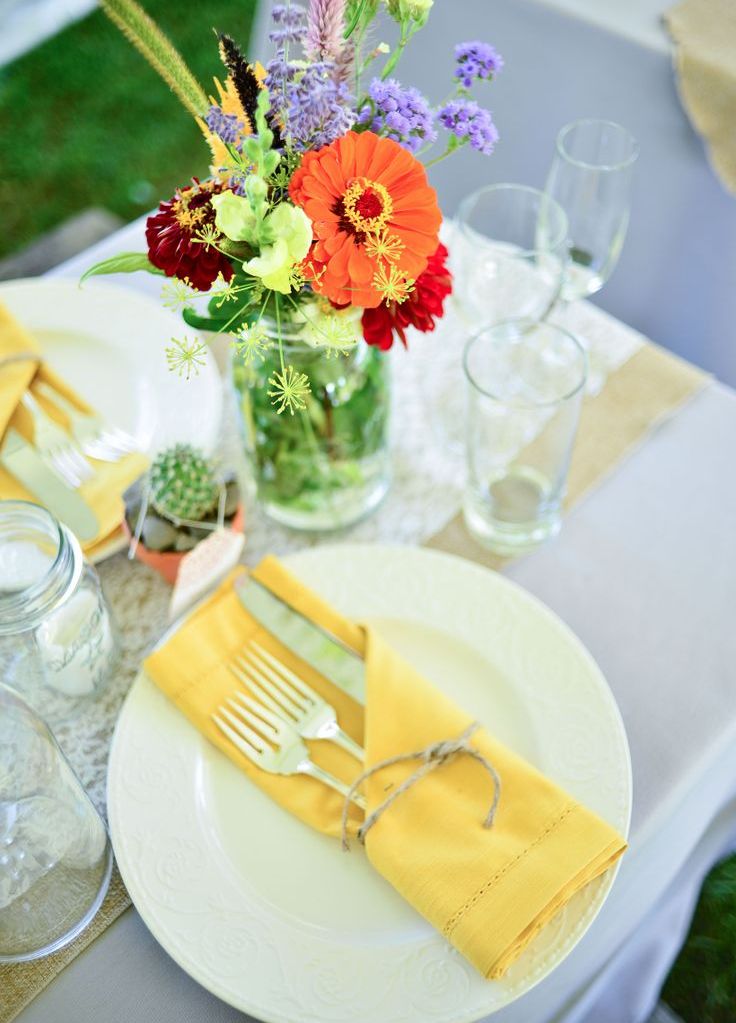Yellow Napkins Tied with Twine Hold Silverware