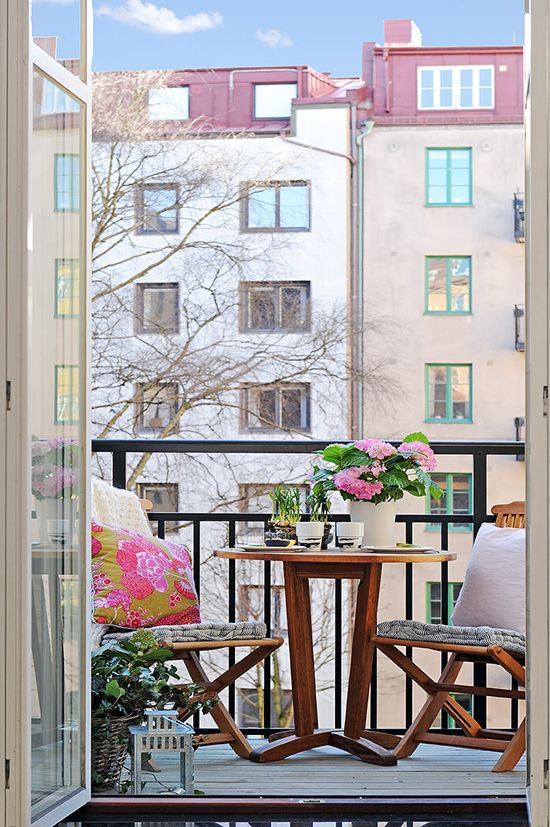 Round Wooden Table For Intimate Balcony Dining