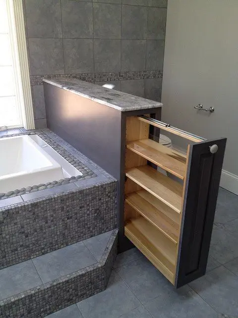 Pull-Out Shelving Unit Adds Discreet Storage Next to Tub
