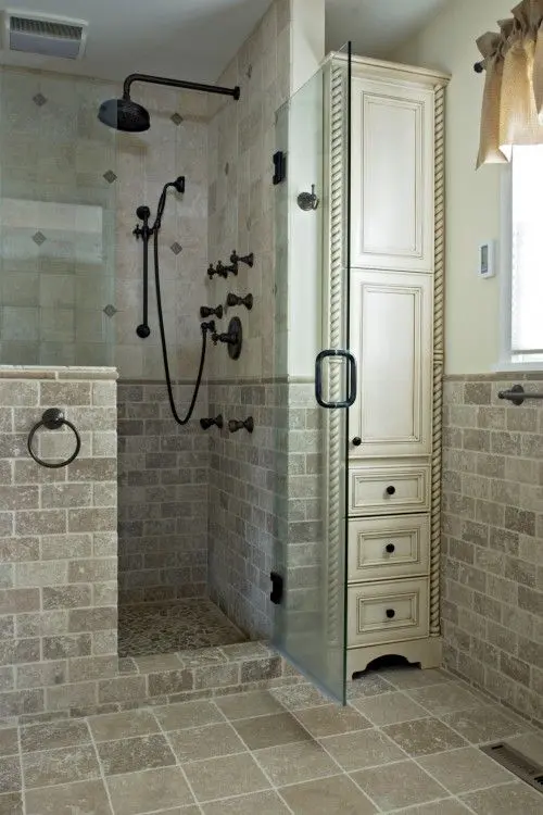 Tall Cream Cabinet Adds Storage Next to Glass Shower