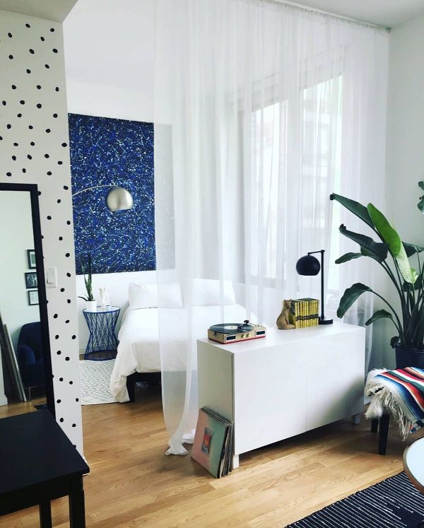 White Cabinet With Record Player and Vinyl