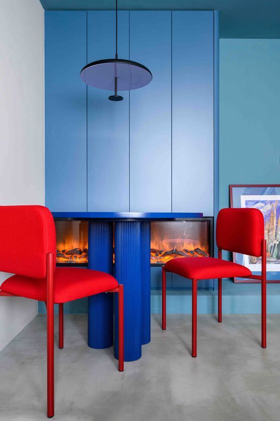 Bold Red Chairs Create a Playful Dining Spot
