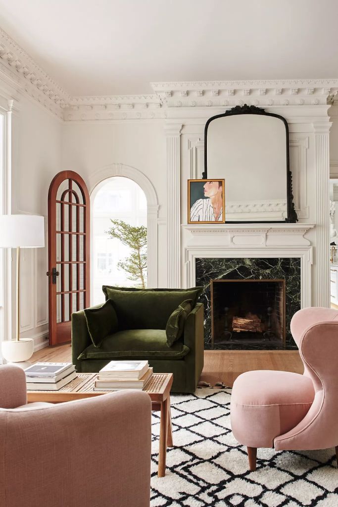 Artwork and Mirror Layered Above the Fireplace Mantel