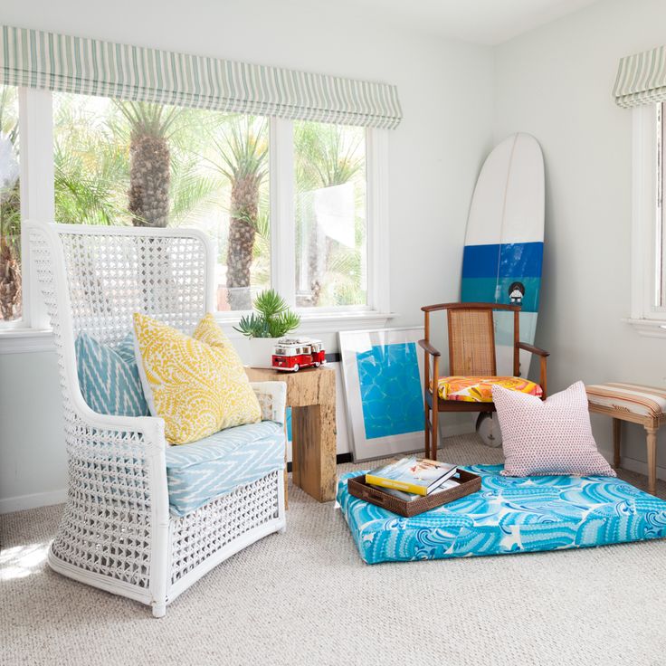 Surfboard Leans Against Chair as Coastal Decor