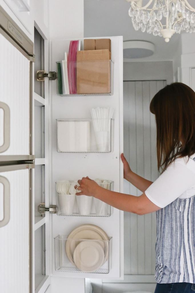 Clear Bins on Cabinet Doors for Party Supplies
