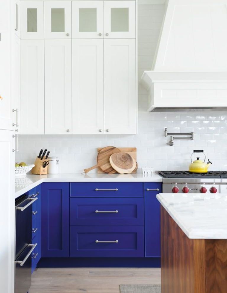 Bold Blue Cabinets Contrast with White Countertops