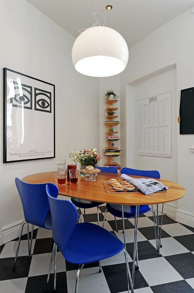 Oval Wood Dining Table Paired with Cobalt Blue Chairs