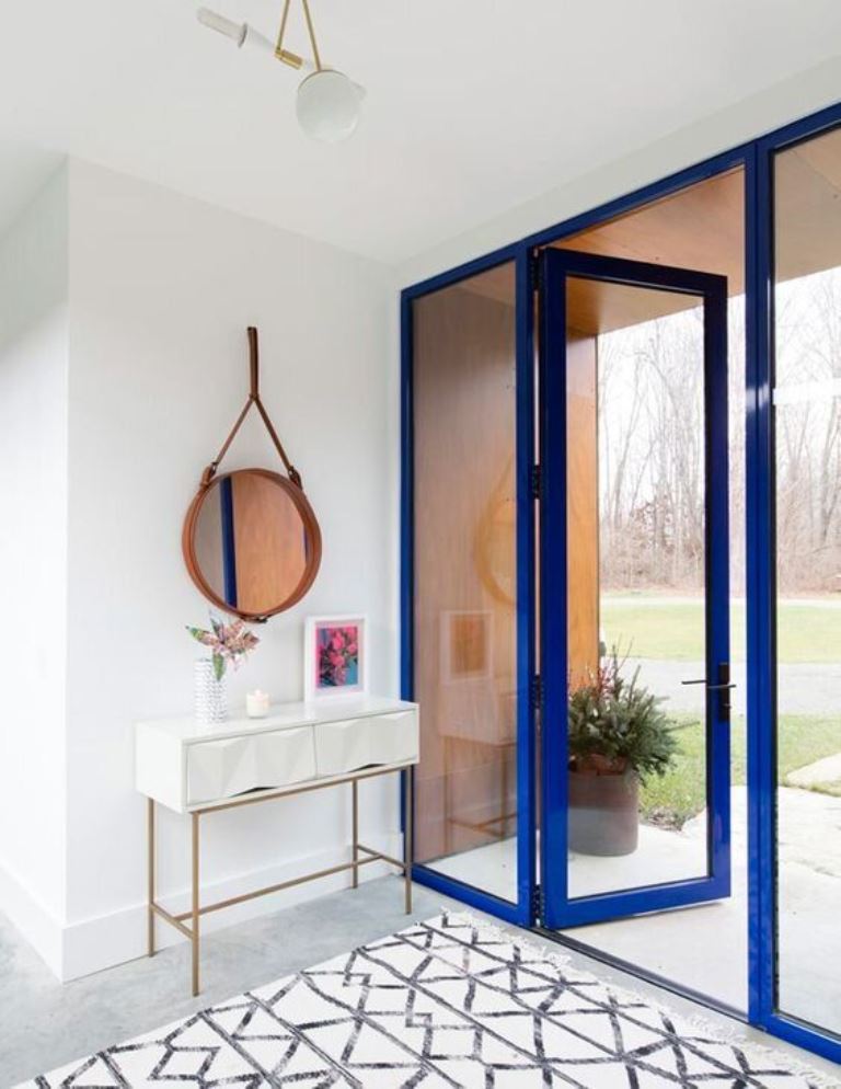 Round Leather-Strap Mirror Adds Rustic Charm to Console Table